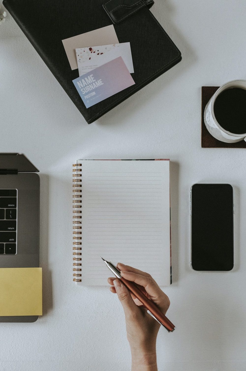 Woman writing on a notebook